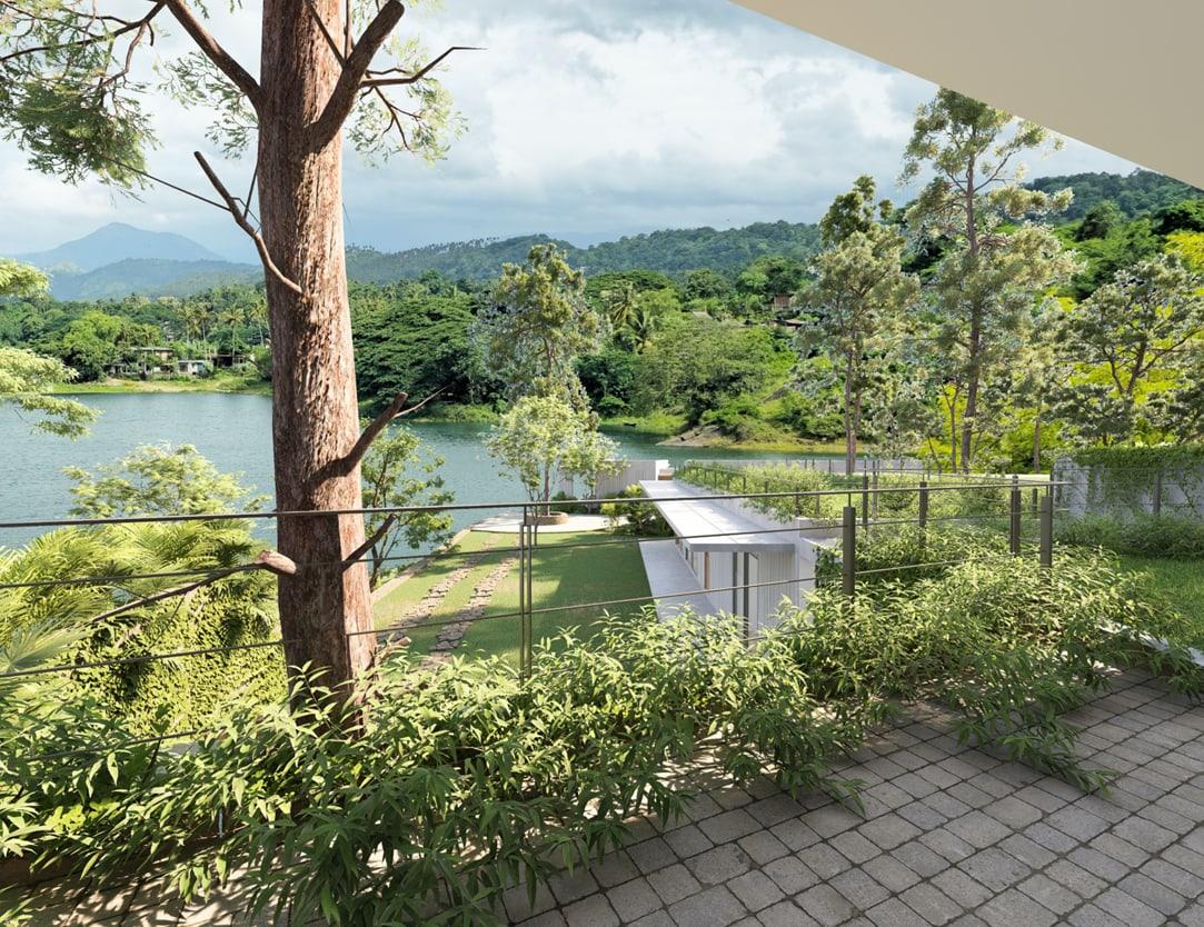 Looking across the Victoria Reservoir from a villa garden, with the hills beyond
